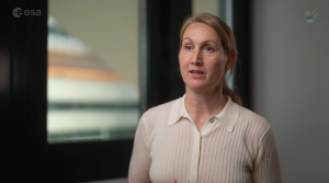 A woman in beige shirt